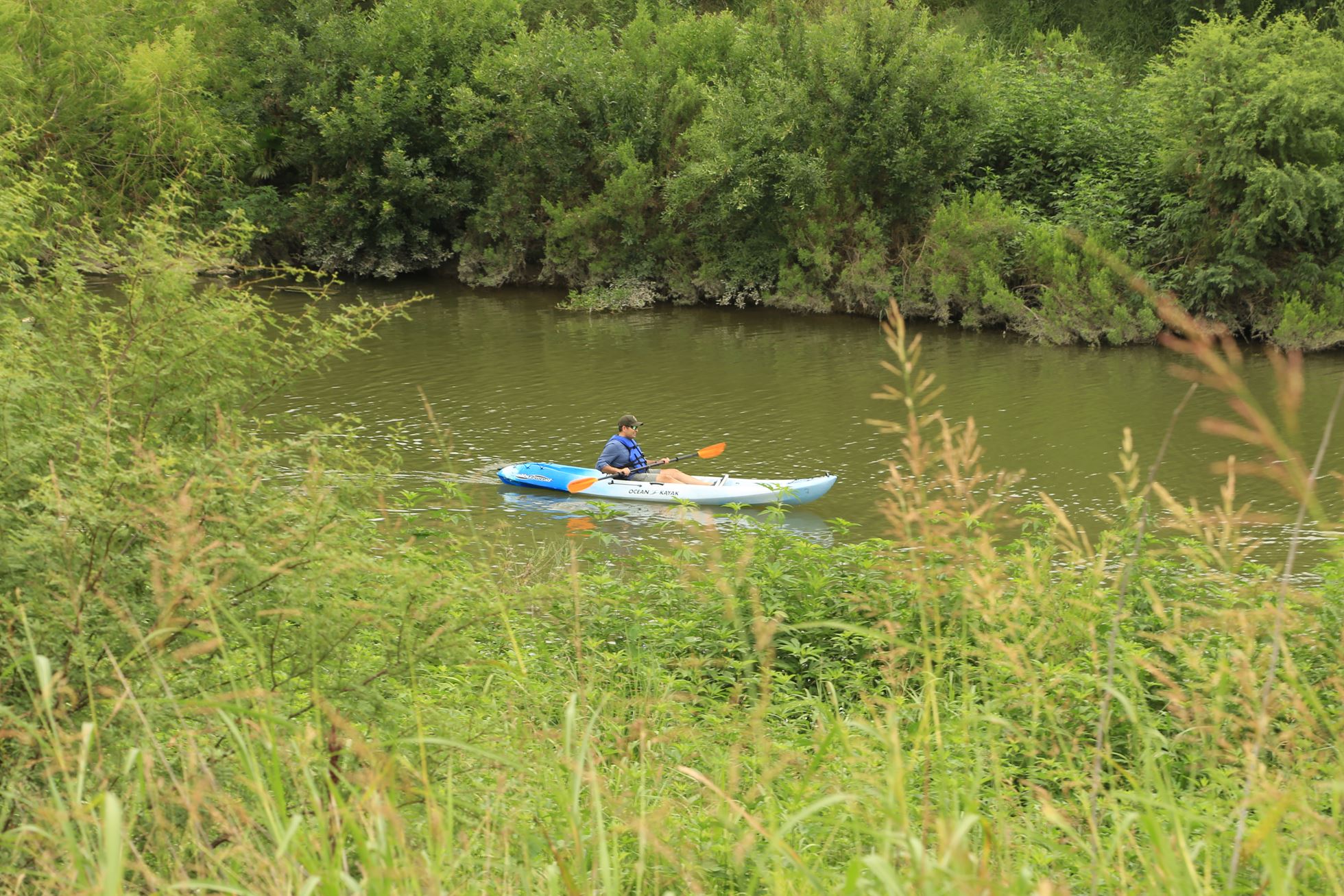 Gilbert S. Gonzalez in a kayak on the San Antonio River.