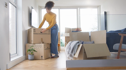 Young Woman Renter moving boxes