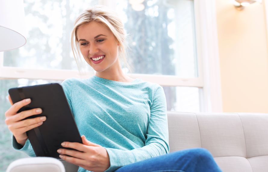 young-woman-using-her-tablet-computer-at-home