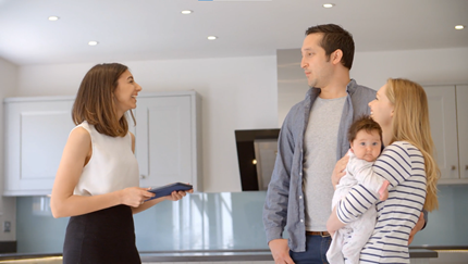 Young Couple and baby with Female REALTOR