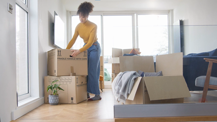 Young-Woman-Renter-moving-boxes.png